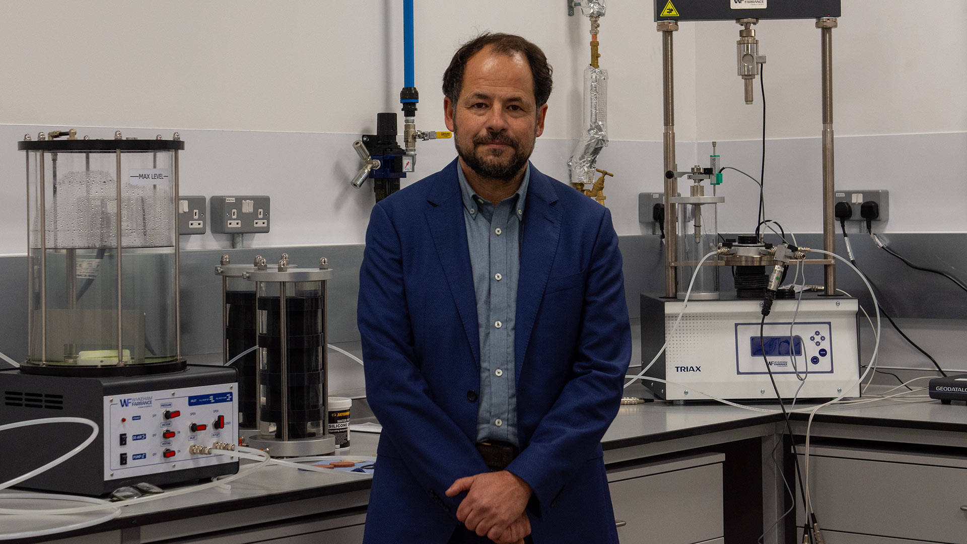 a man standing in an engineering lab
