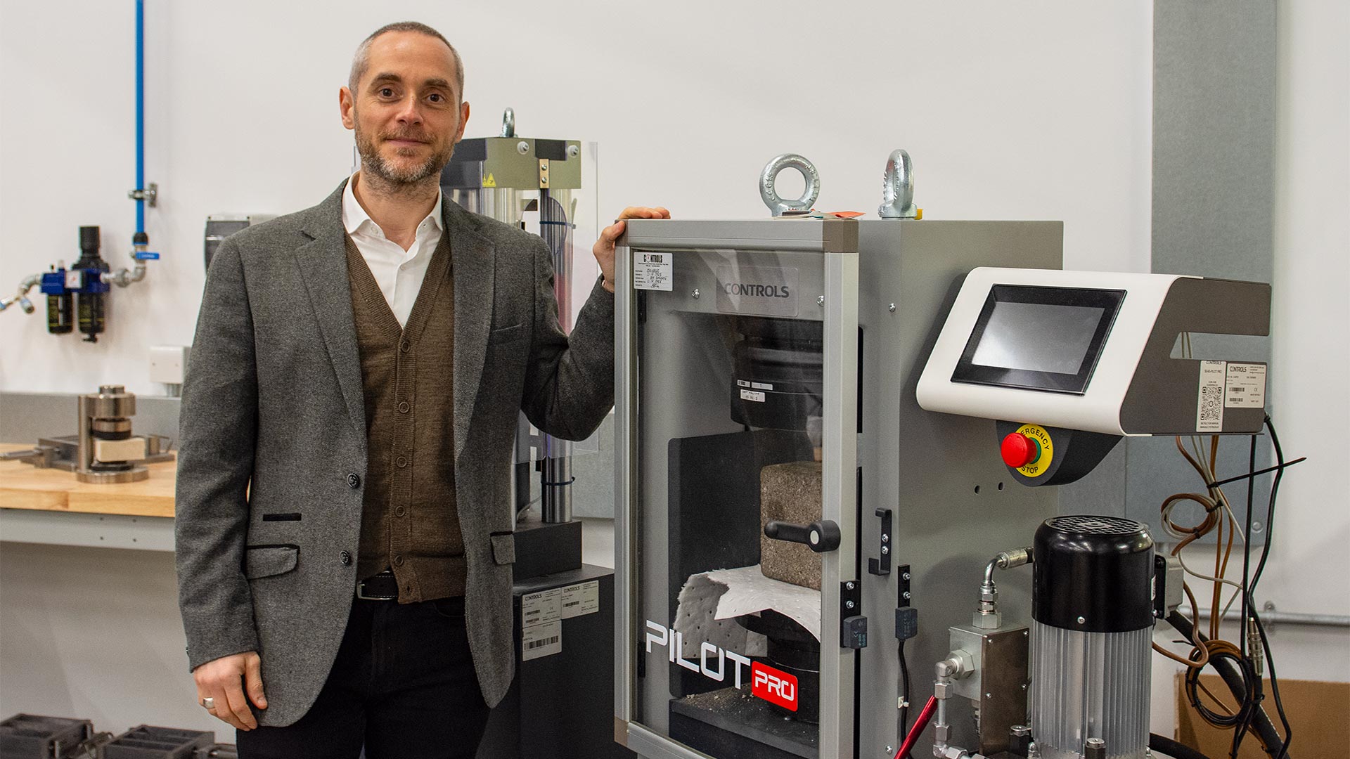 a man standing in an engineering lab