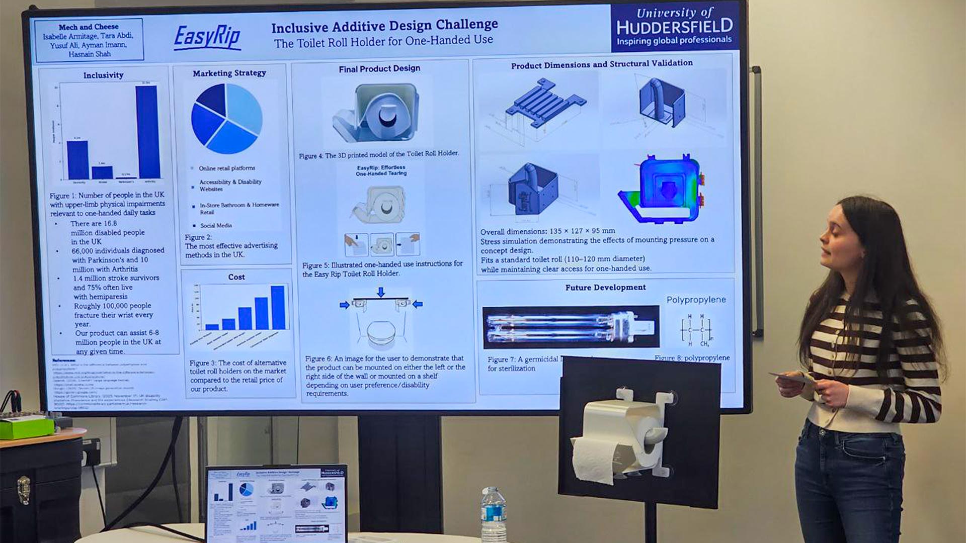 a student presenting in front of a big screen