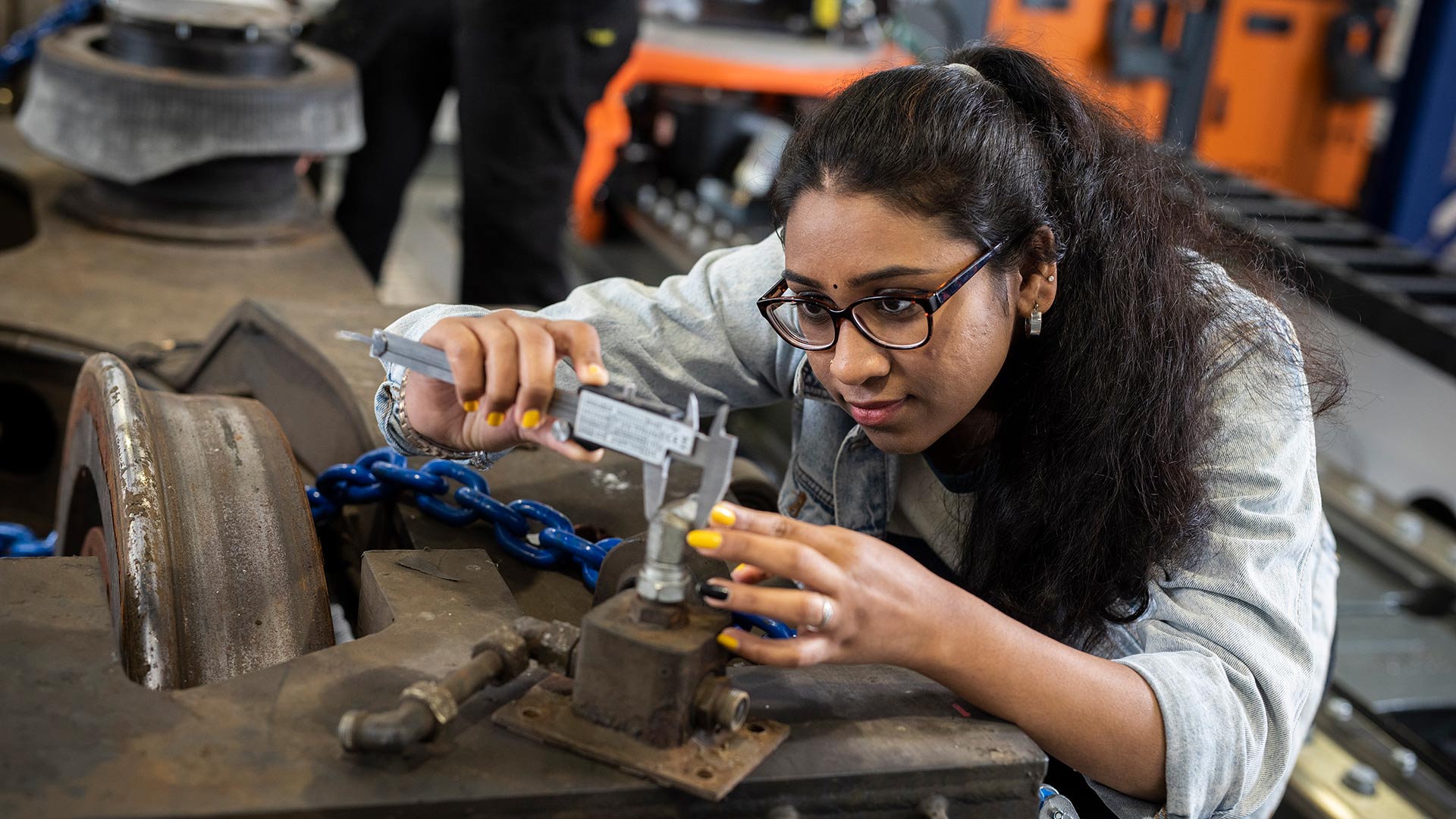 A female student tackling an engineering task