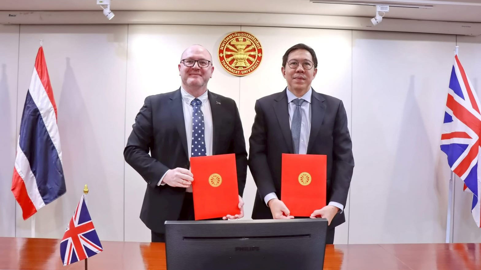 Monty Adkins and Professor Dr Supasawad Chardchawarn, Rector of Thammasat University