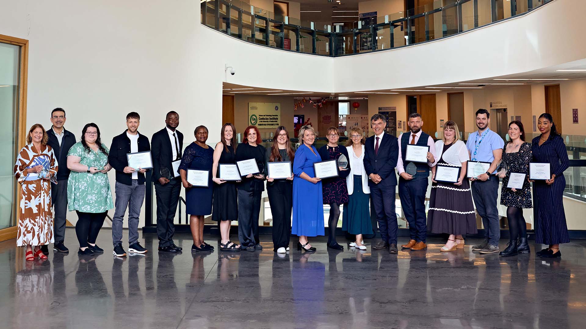 Award winners standing in the Oastler Building lobby