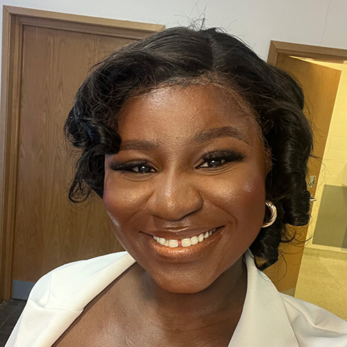 Folusho Alabi smiles at the camera