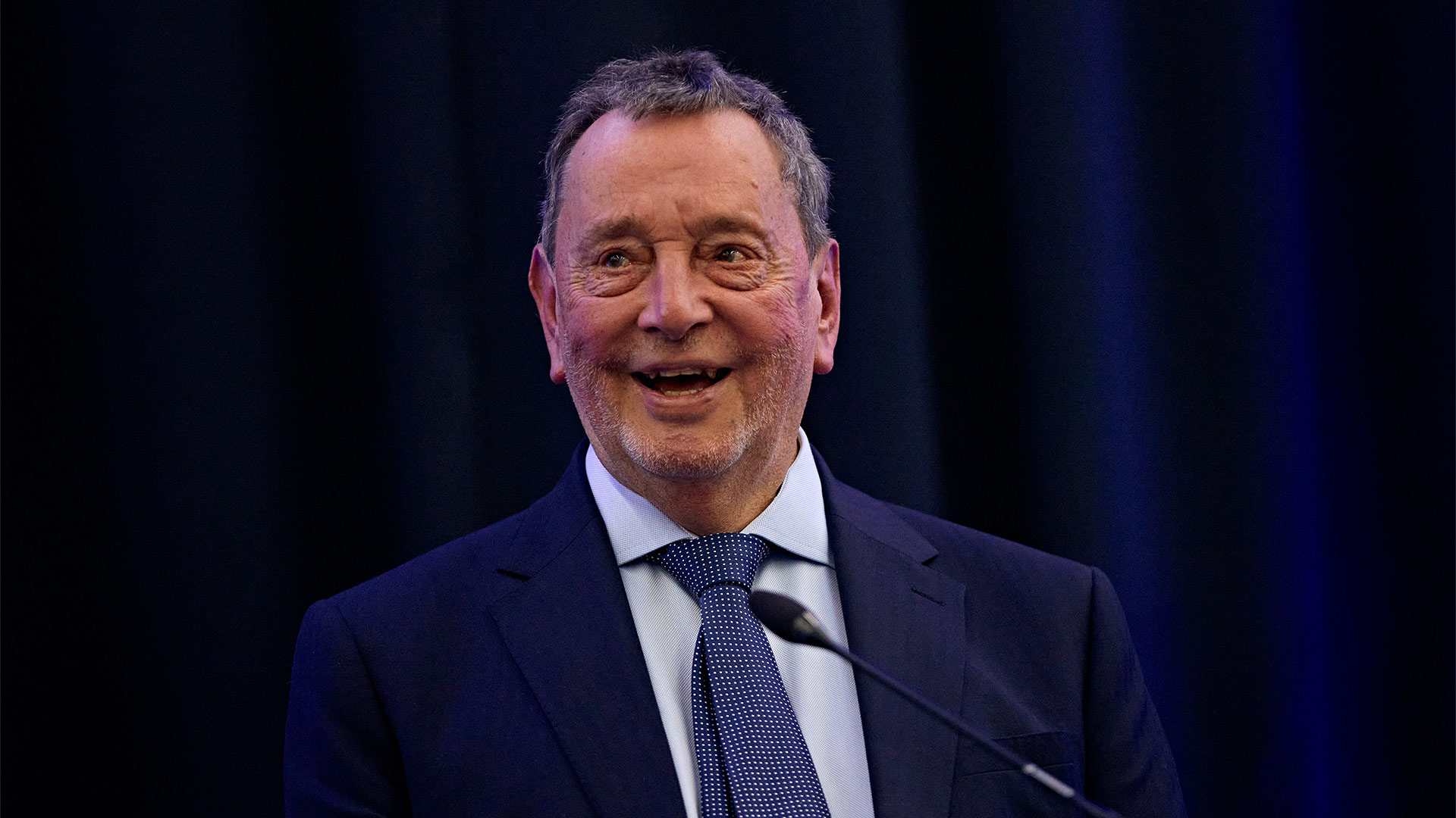 Lord David Blunkett on stage giving a lecture