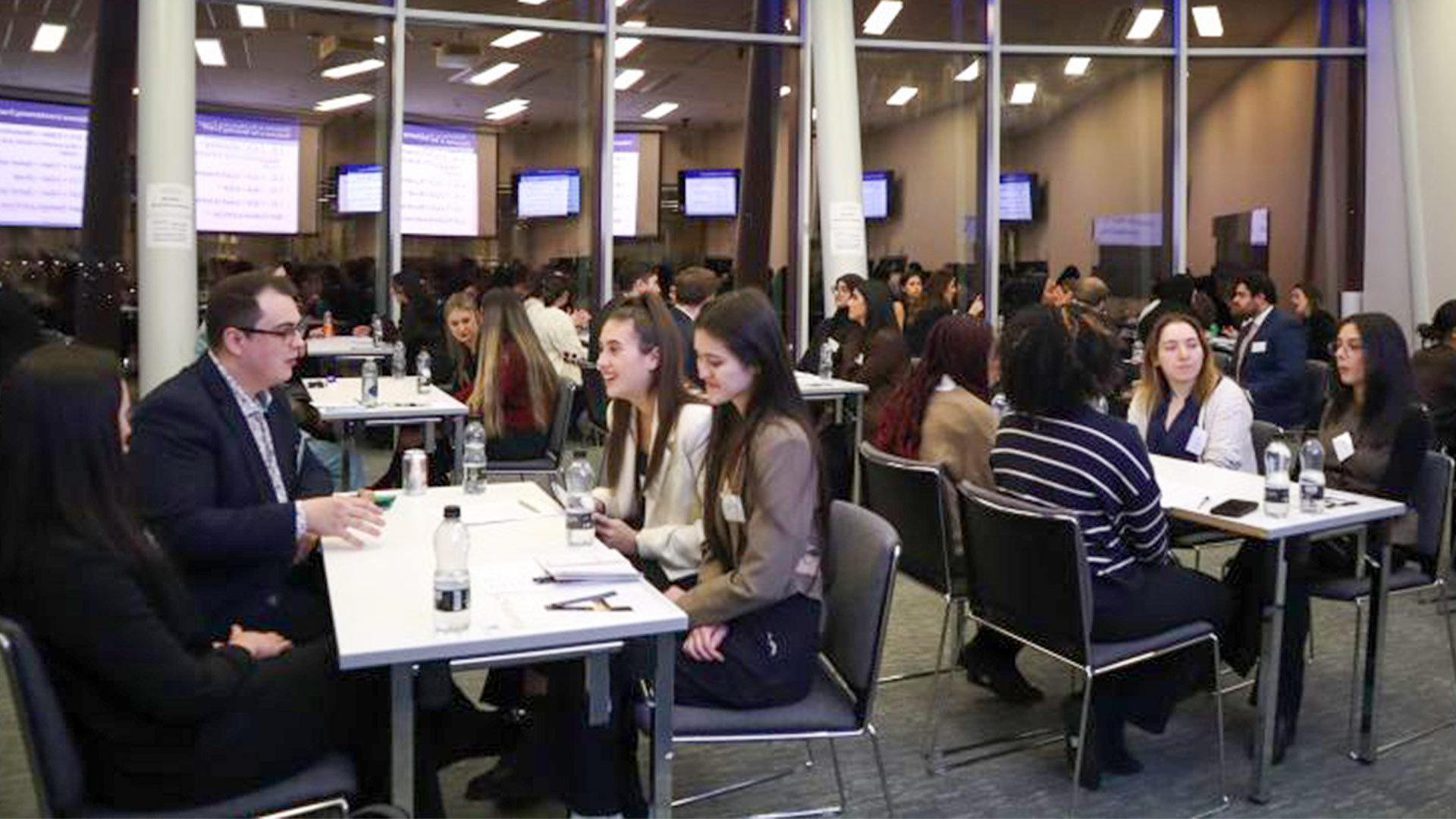students sat around a table at a careers networking event