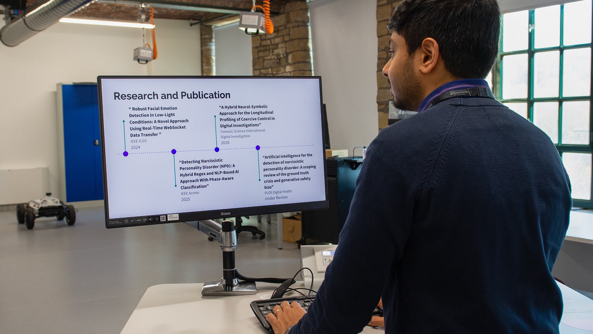 a man looking at a computer screen