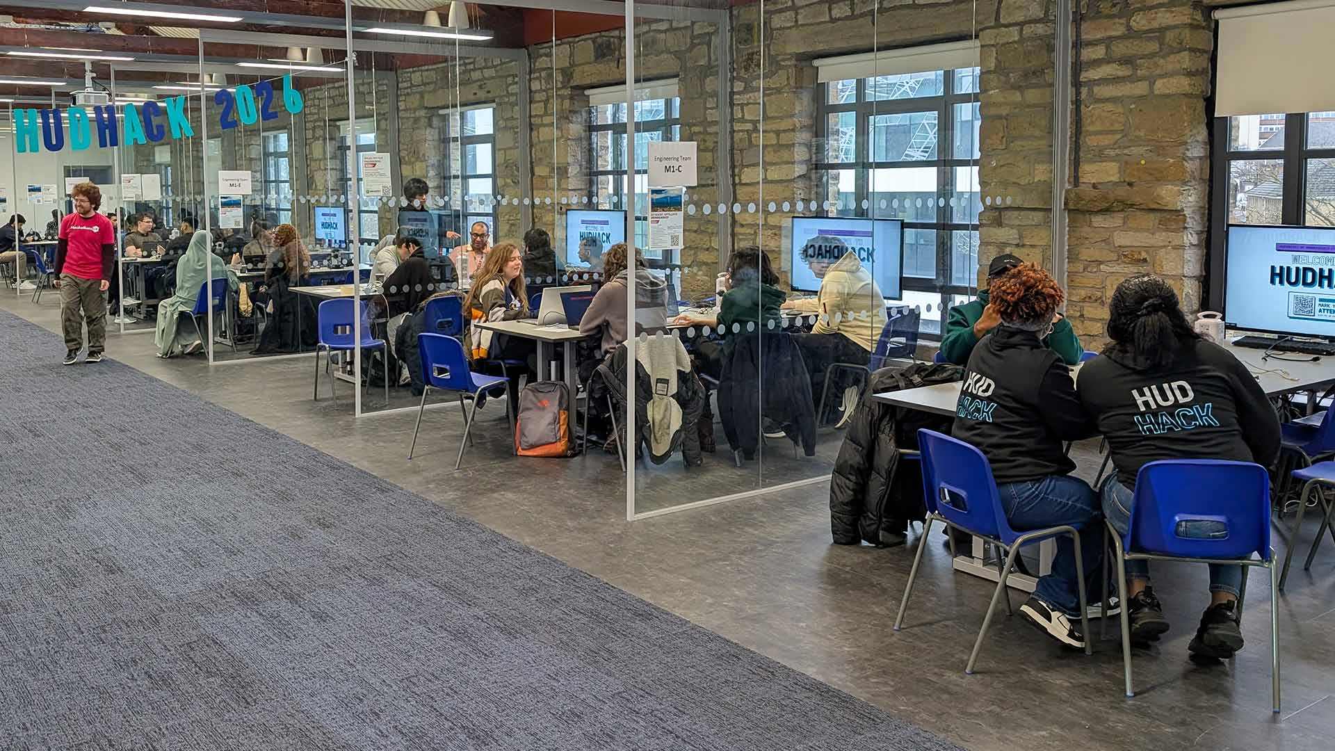 Students in computer booths taking part in a competition