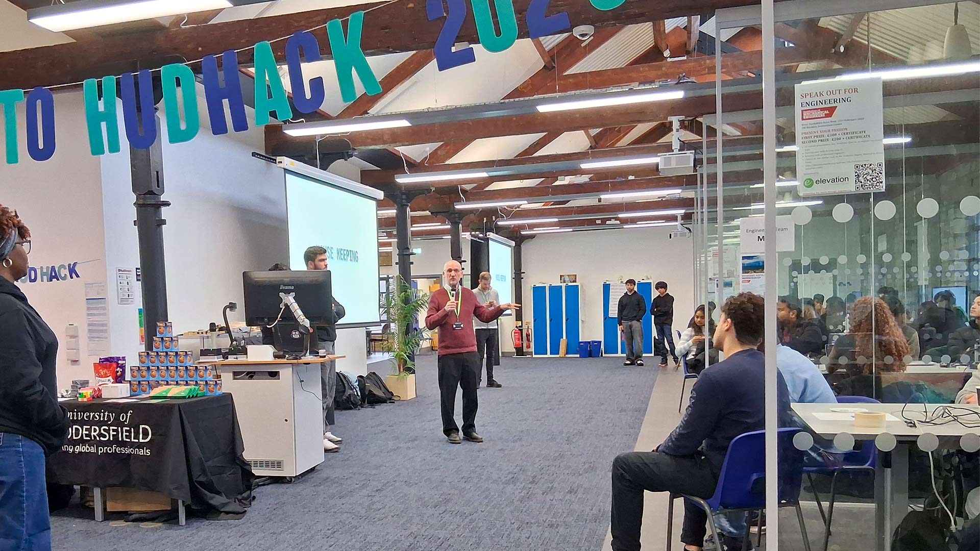 A man giving a speech in front of students