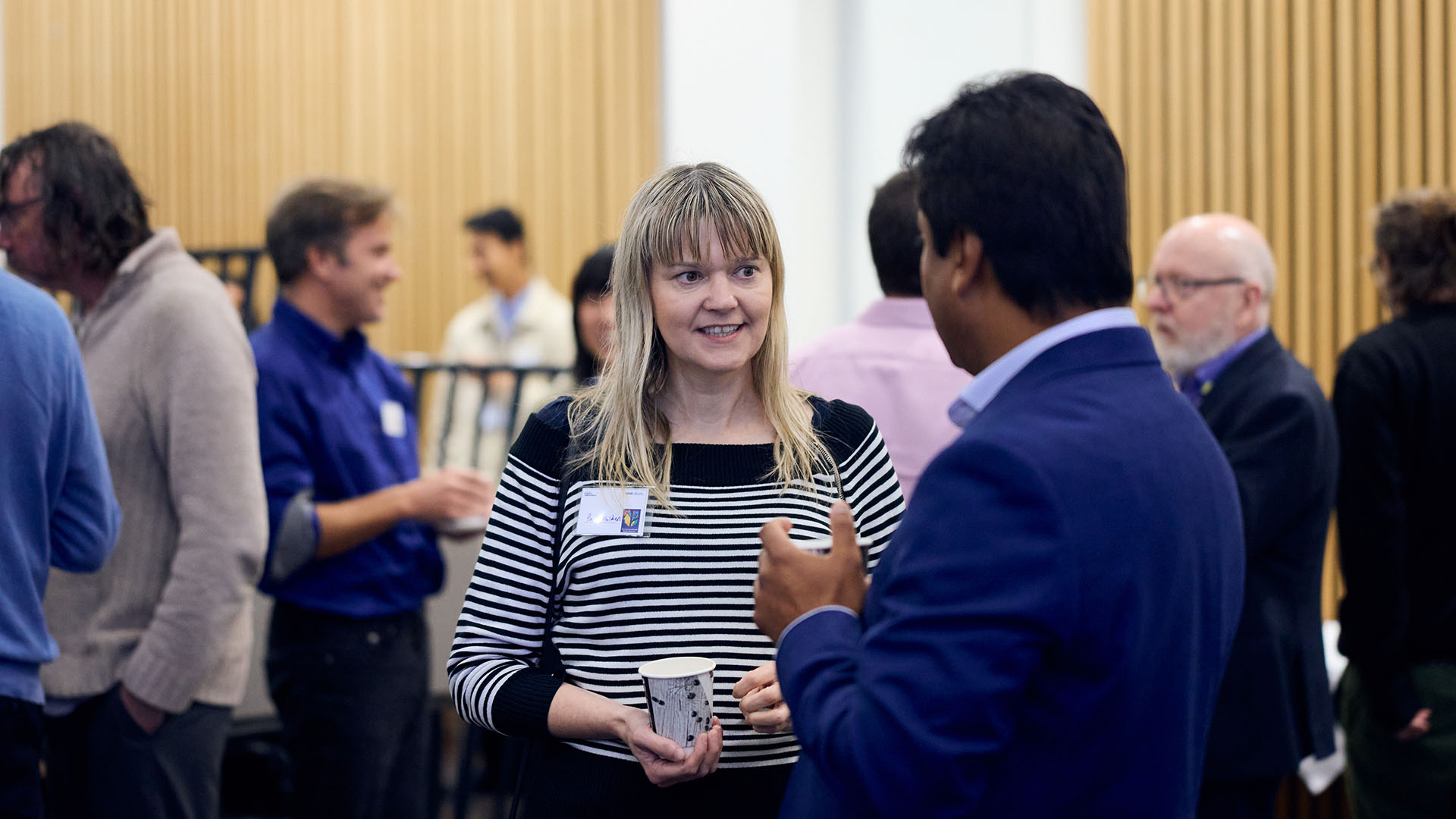 People mingle at a conference