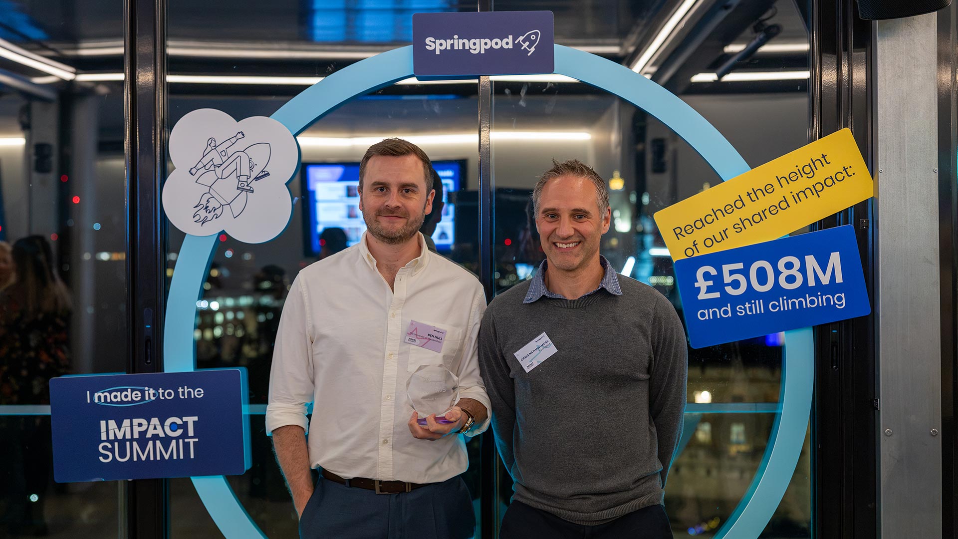 University of Huddersfield representative with a Springpod representative at the Springpod Impact Summit, where the University received a Springpod Impact Award.