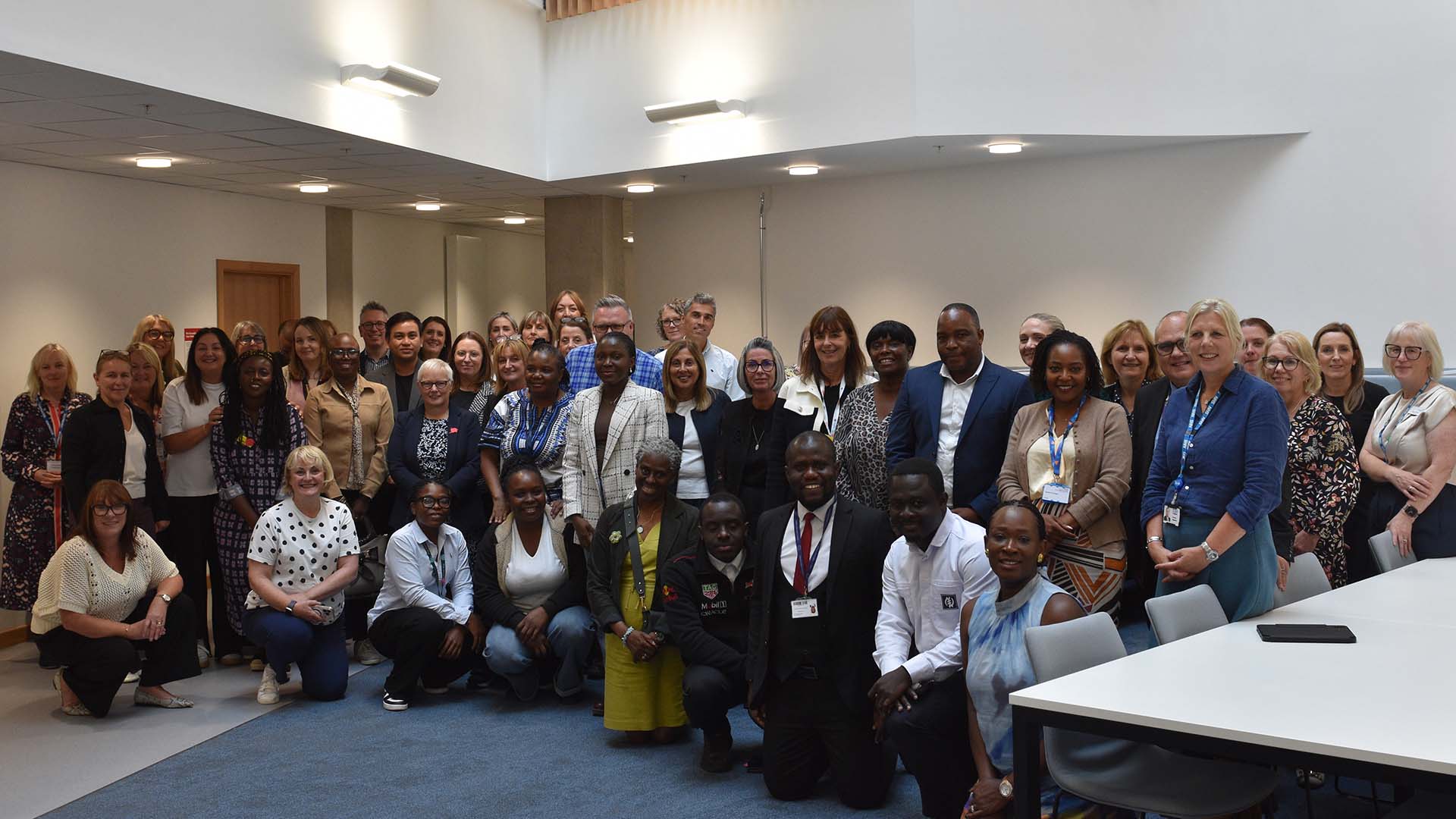 A group of delegates at a conference at the Emily Siddon Building