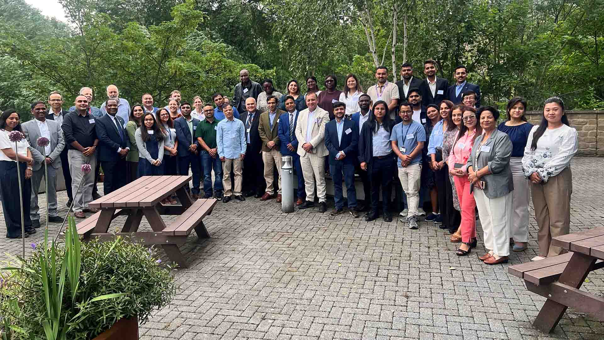 A group of delegates at a conference stood outside