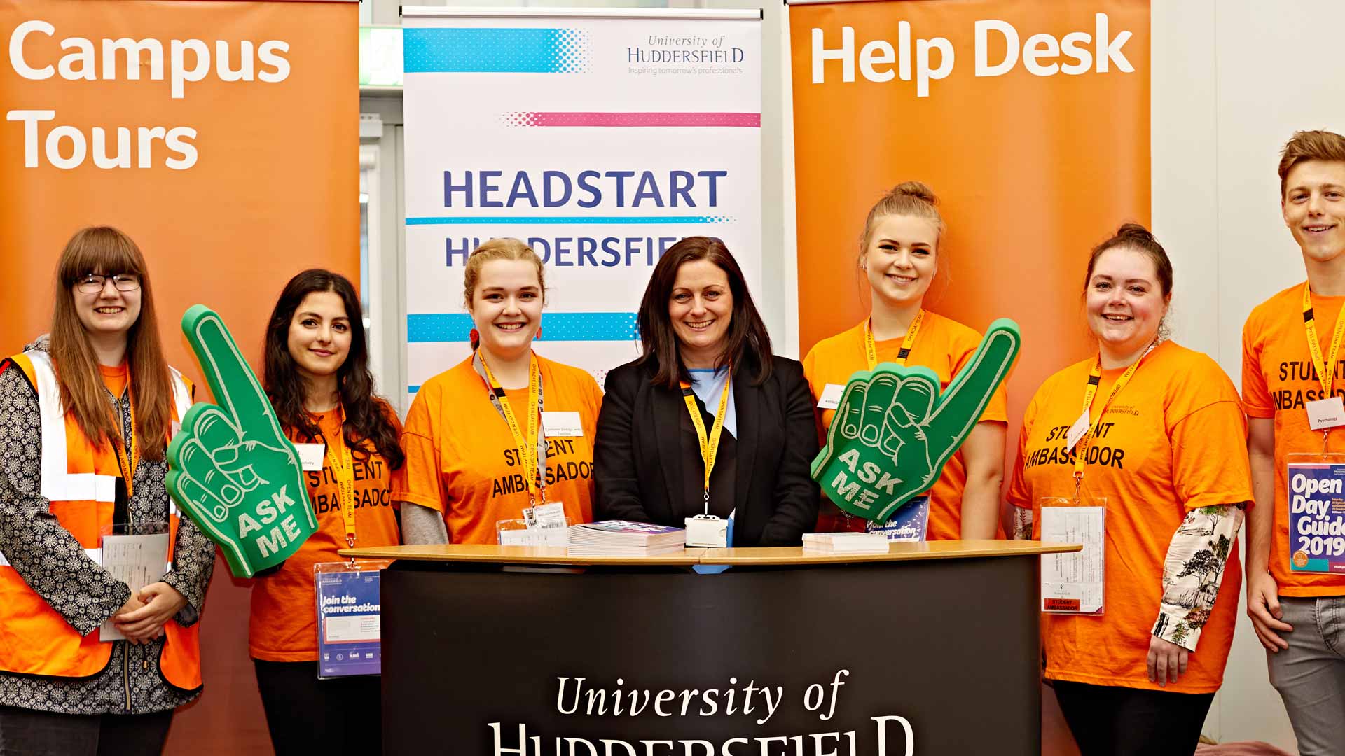 Help desk at an Open Day with students and support staff waiting for visitors to attend.