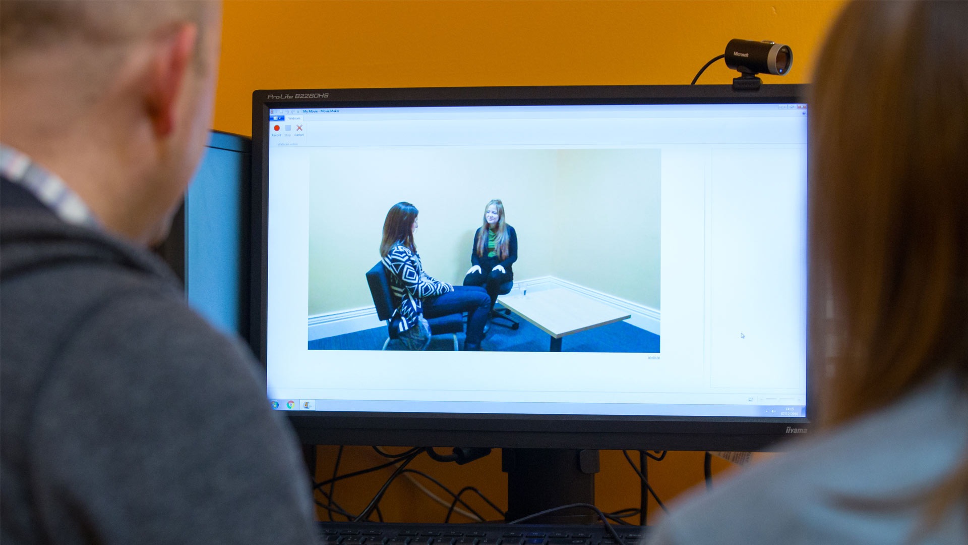 Workers watching police interview from another room