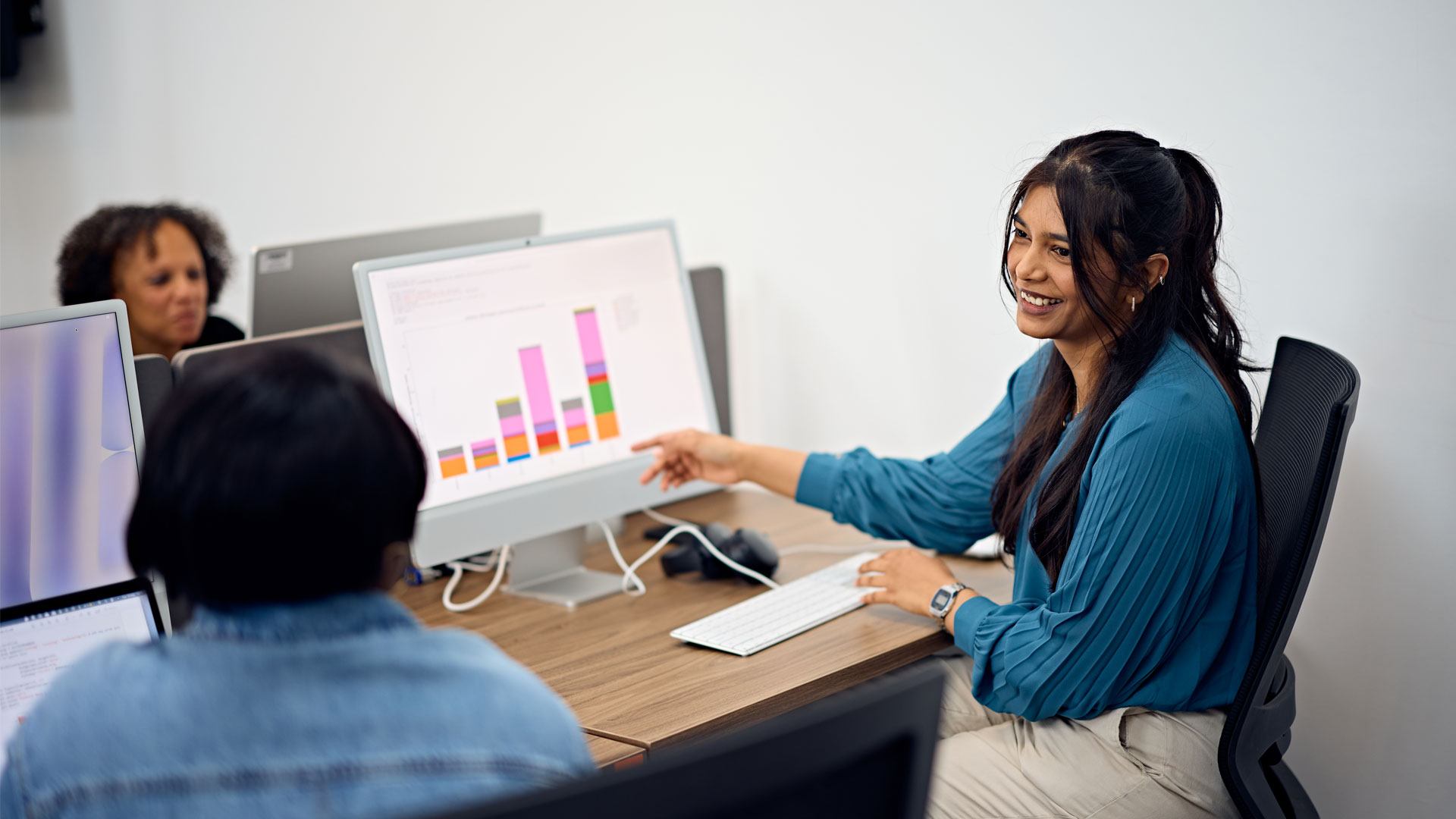 Researcher discussing project work and findings with another researcher
