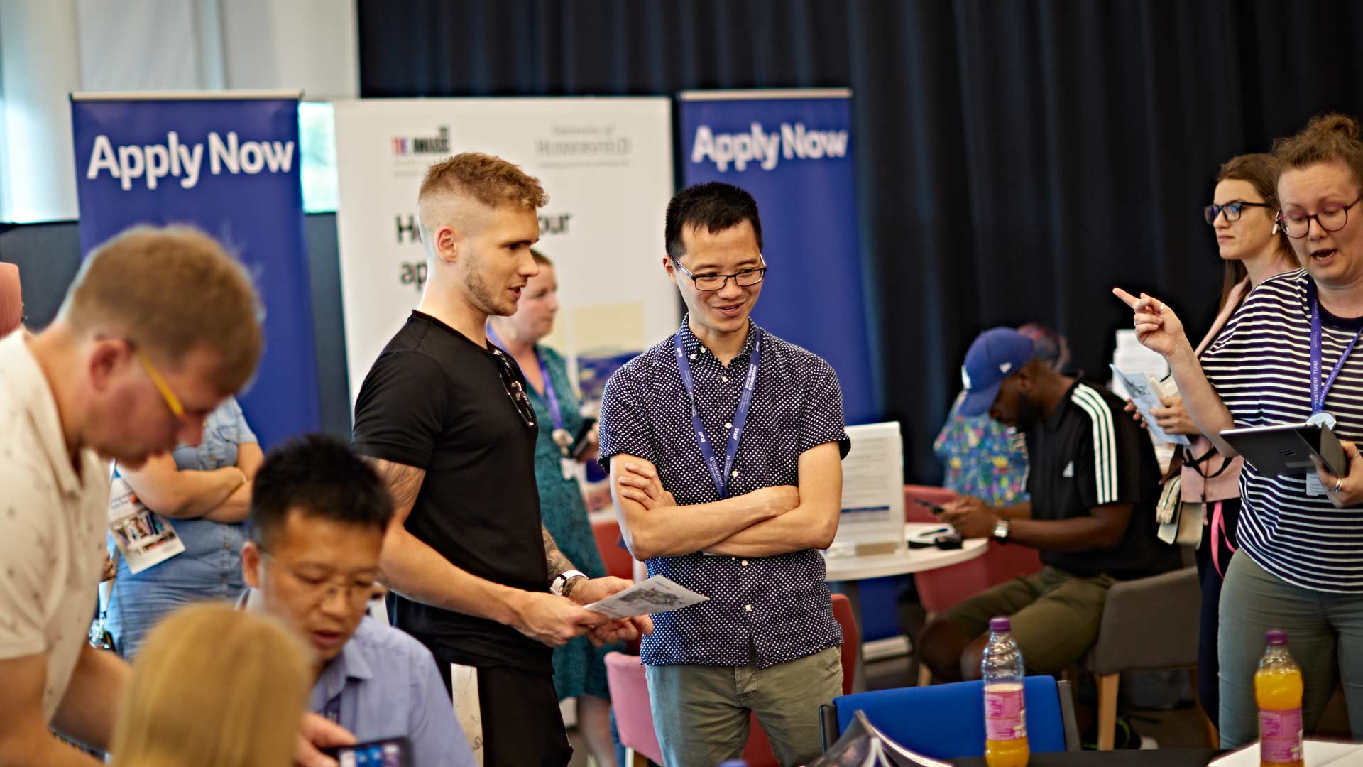 Staff and prospective students having conservations across postgraduate open day