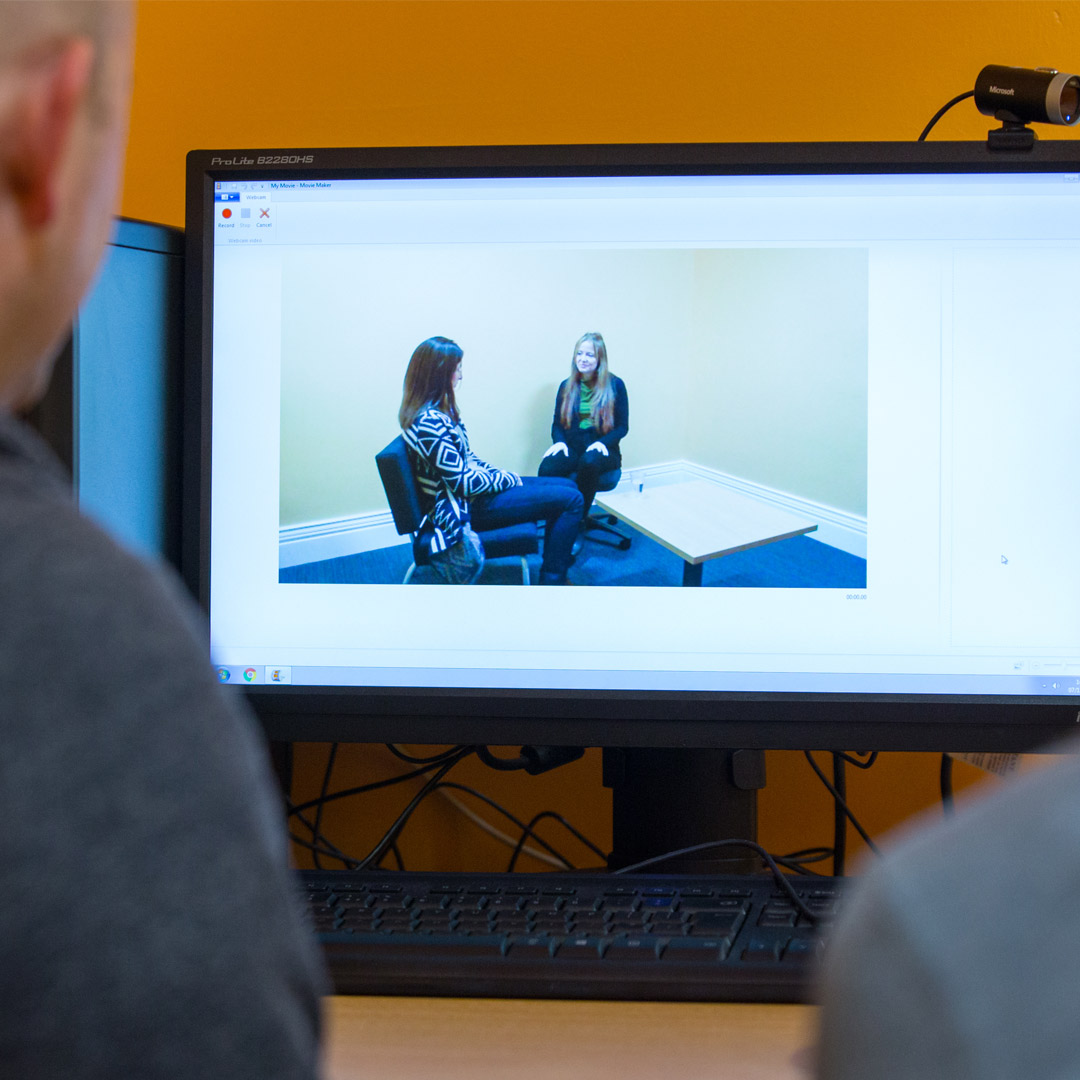 Workers watching police interview from another room