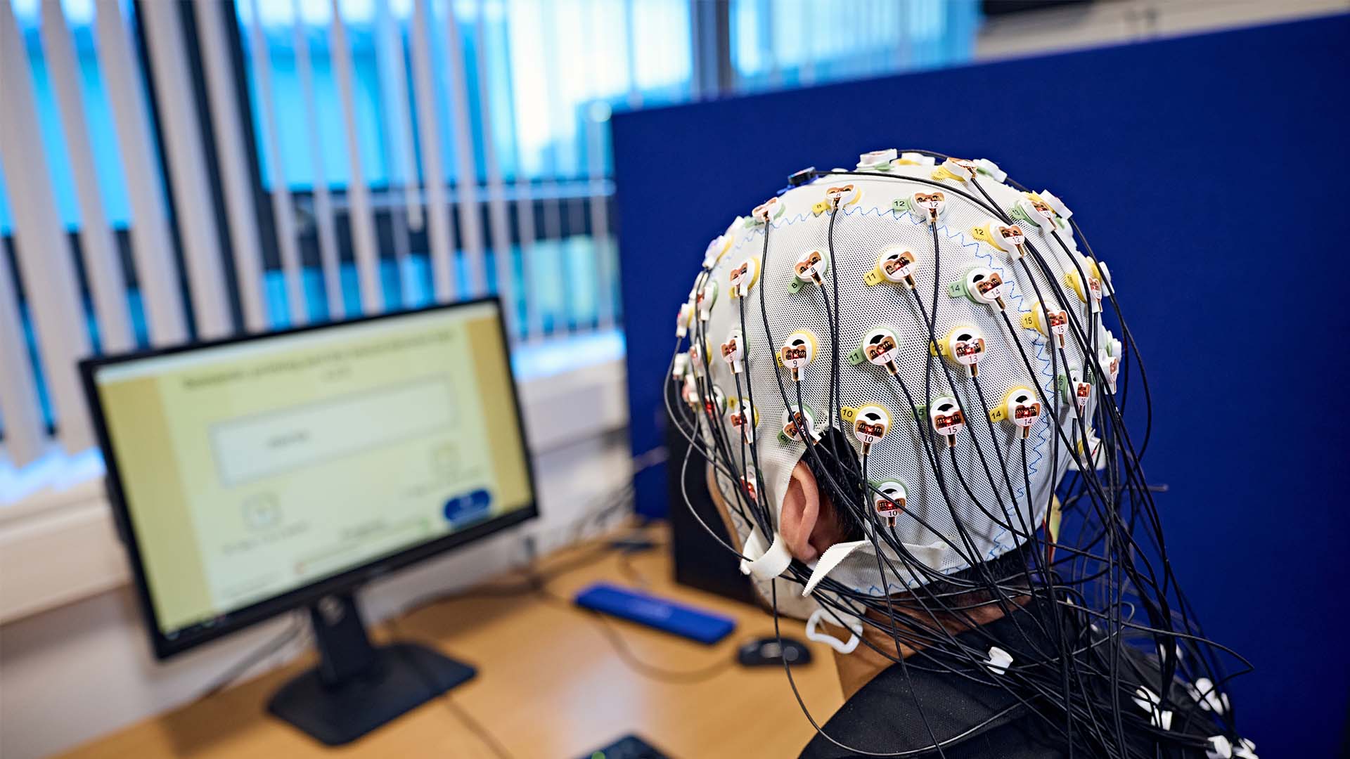 Psychology student wearing a brainwave monitoring device