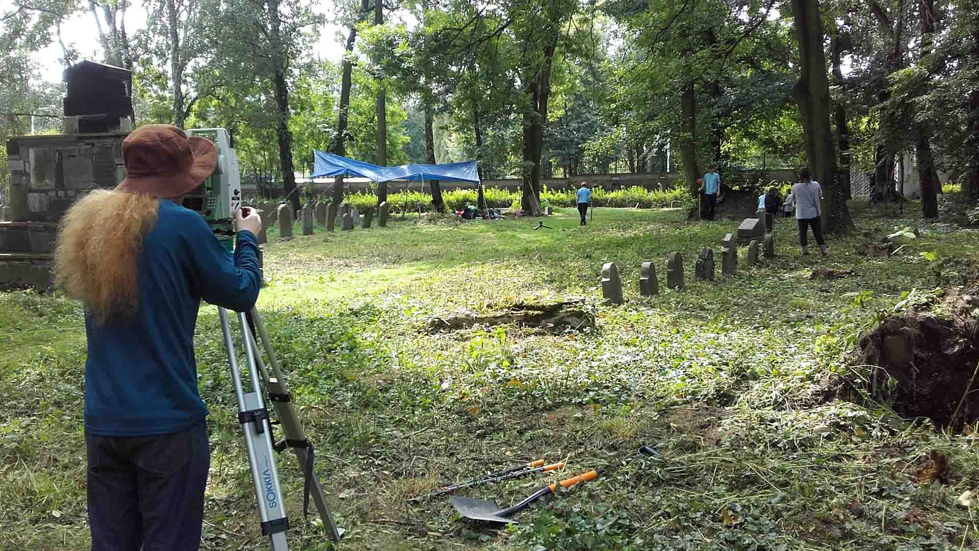 Archaeology students recording a dig site