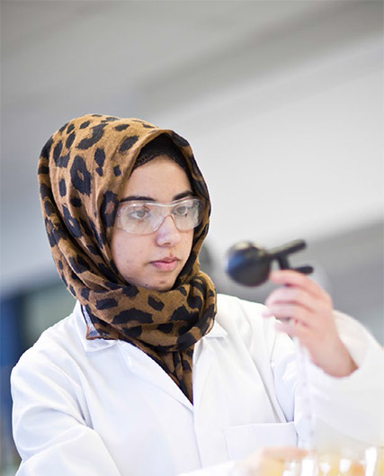 Female scientist in a lab conducting an experiment