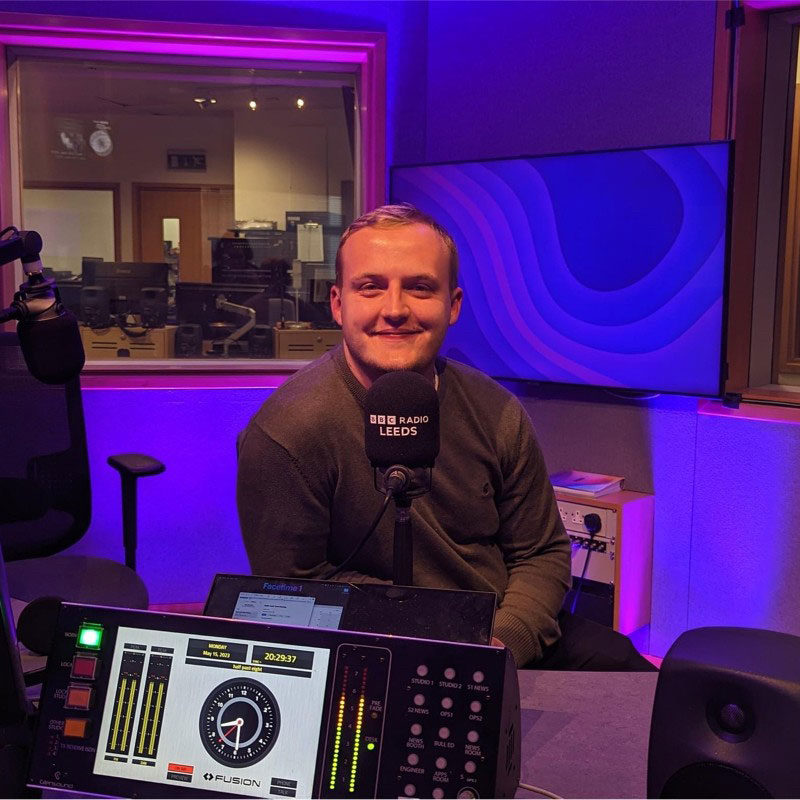 a photo of jacob in a room with blue lighting