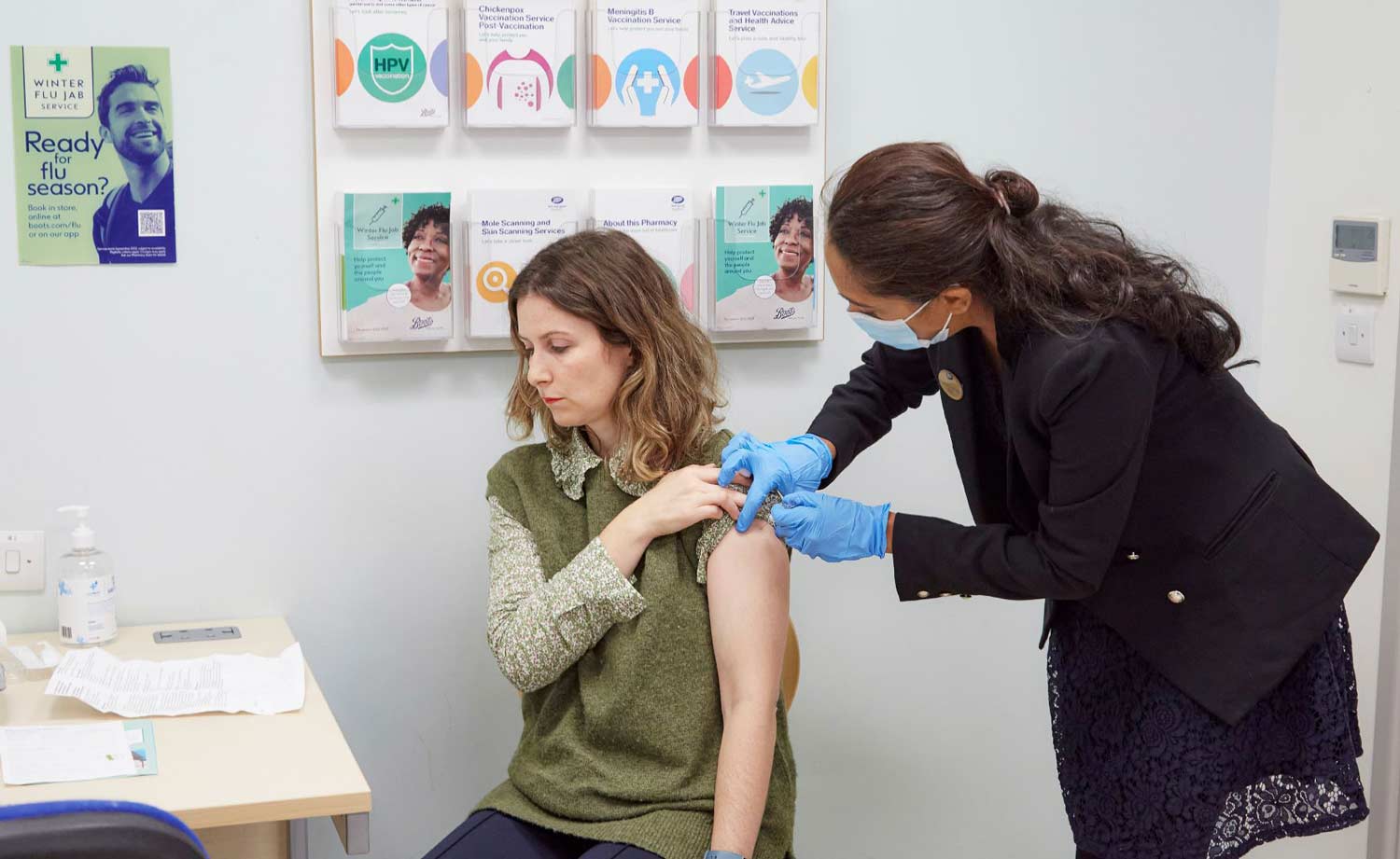 someone administering a flu jab