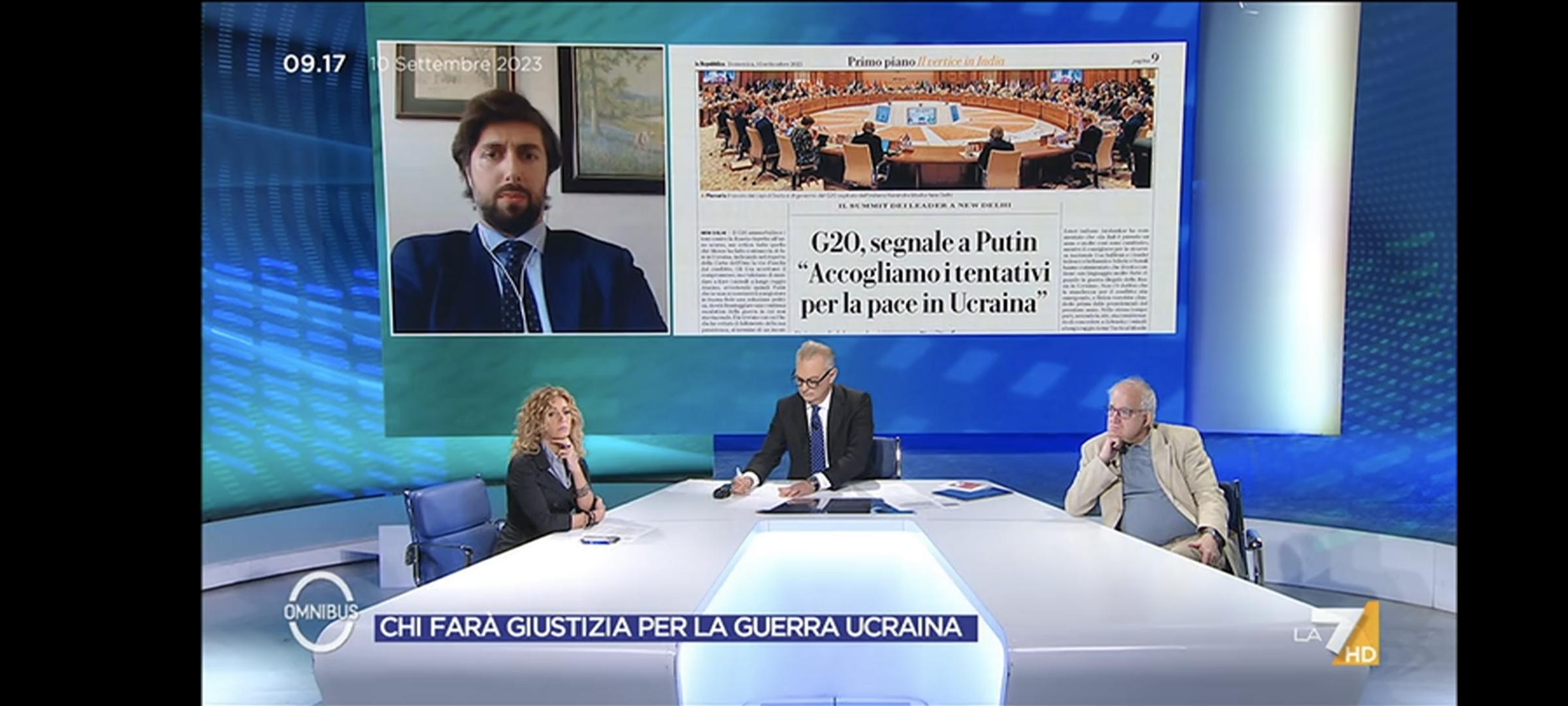 Tv presenters sat around with Giovanni on a screen behind