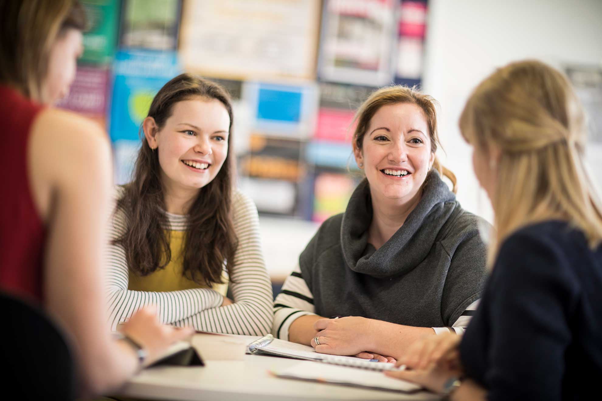 group-of-female-student-sat-around-table