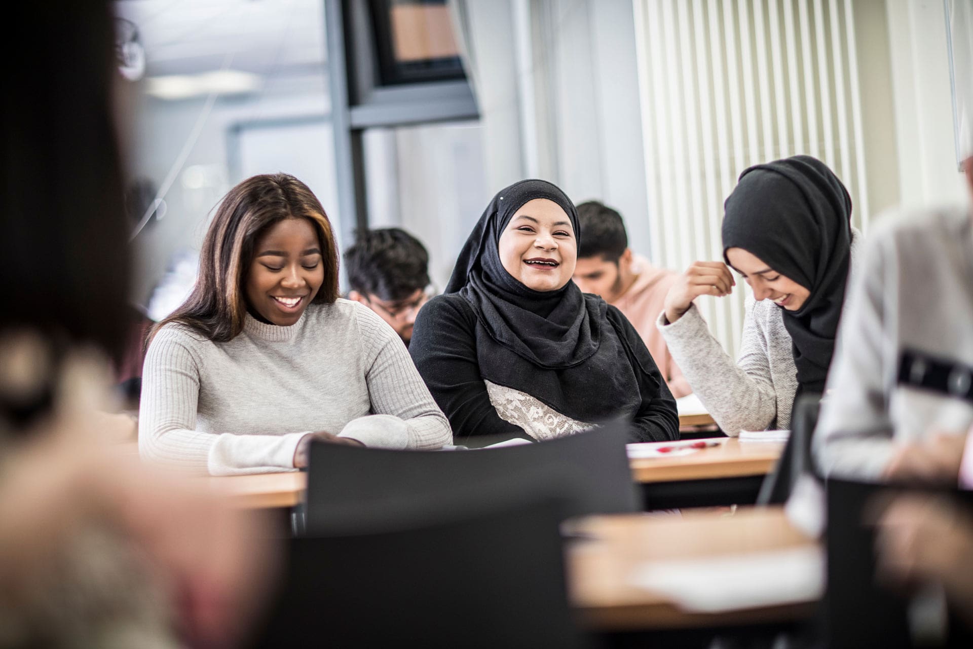 Students in class laughing