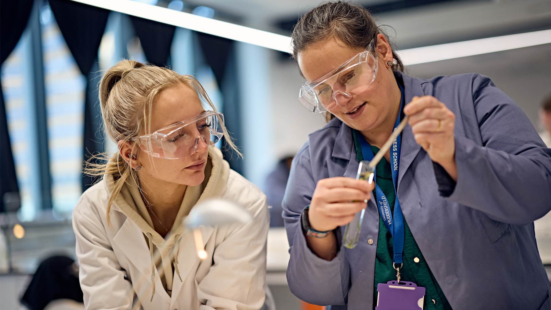 Two students working together on project in lab