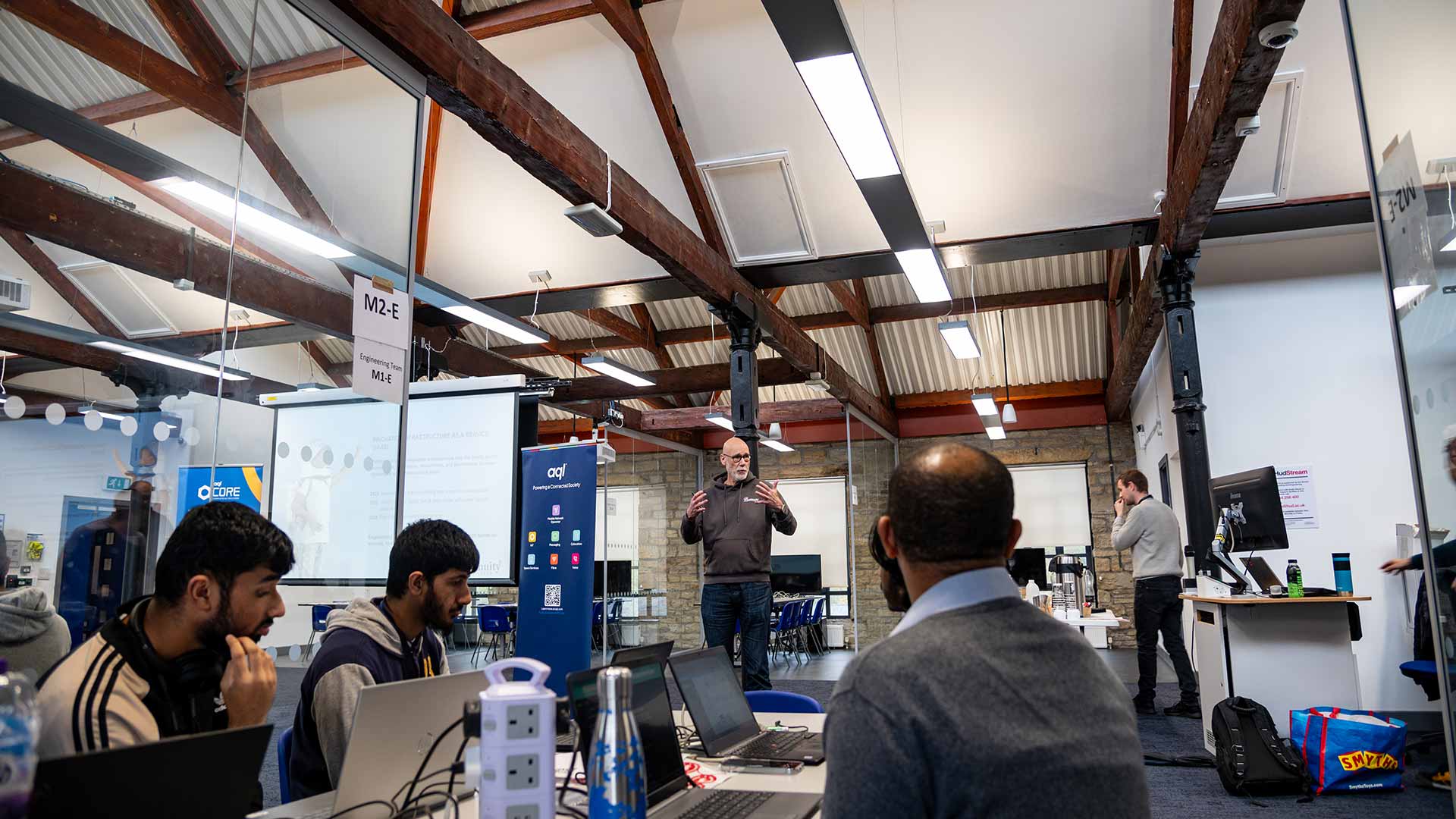 Edwin and a few students sat in a computing facility listening to an academic teaching.