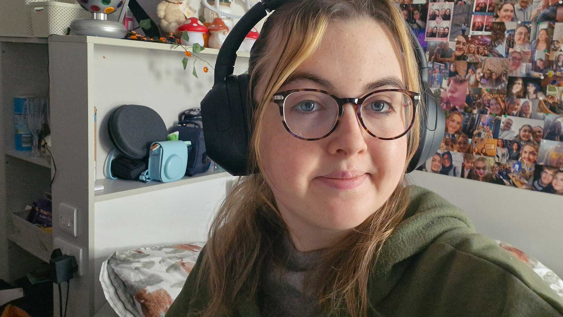 Eloise earing headphones.