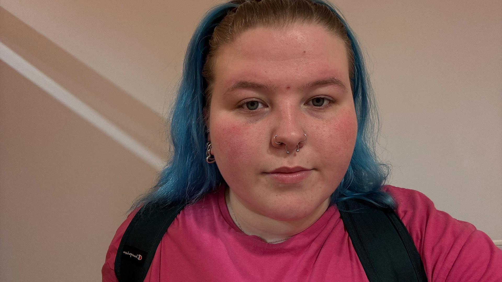 Headshot of Erin, wearing a rucksack.