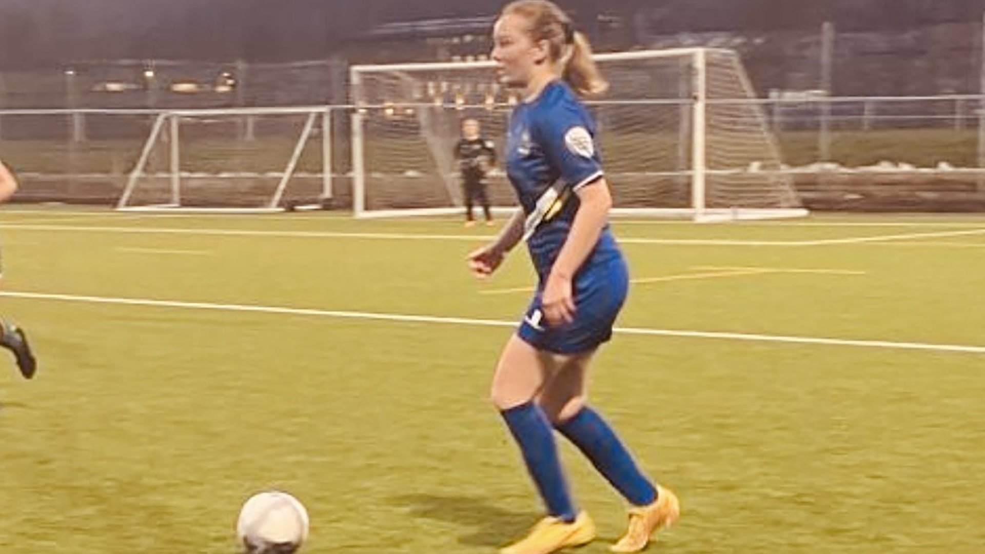 Phoebe playing football.