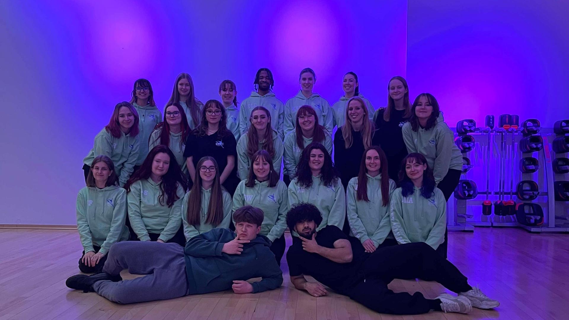Syed and his dance group posing for a photo.
