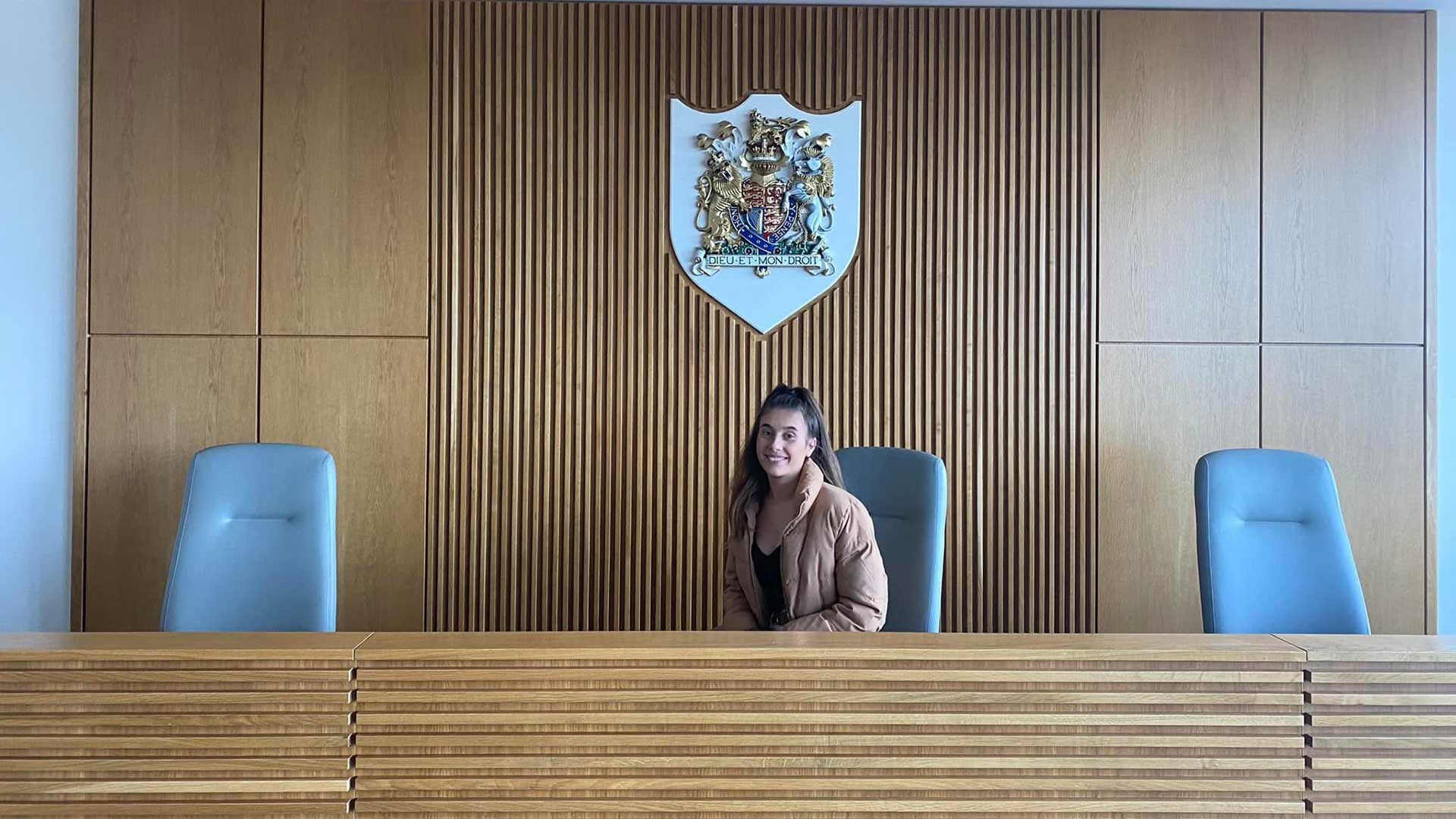 Tayler sat in the University's mock courtroom facility.