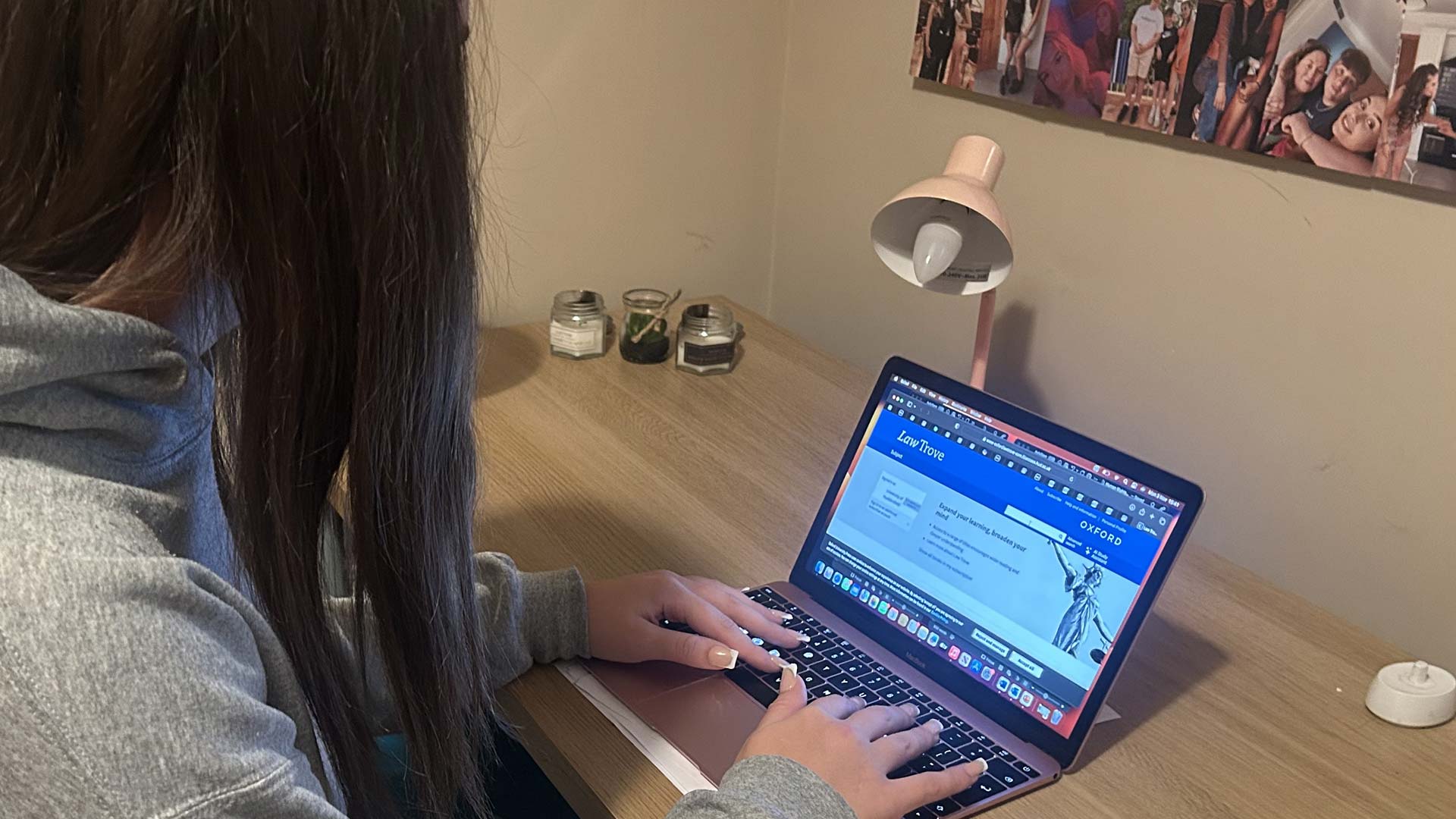 Tayler sat at her bedroom desk, using her laptop.