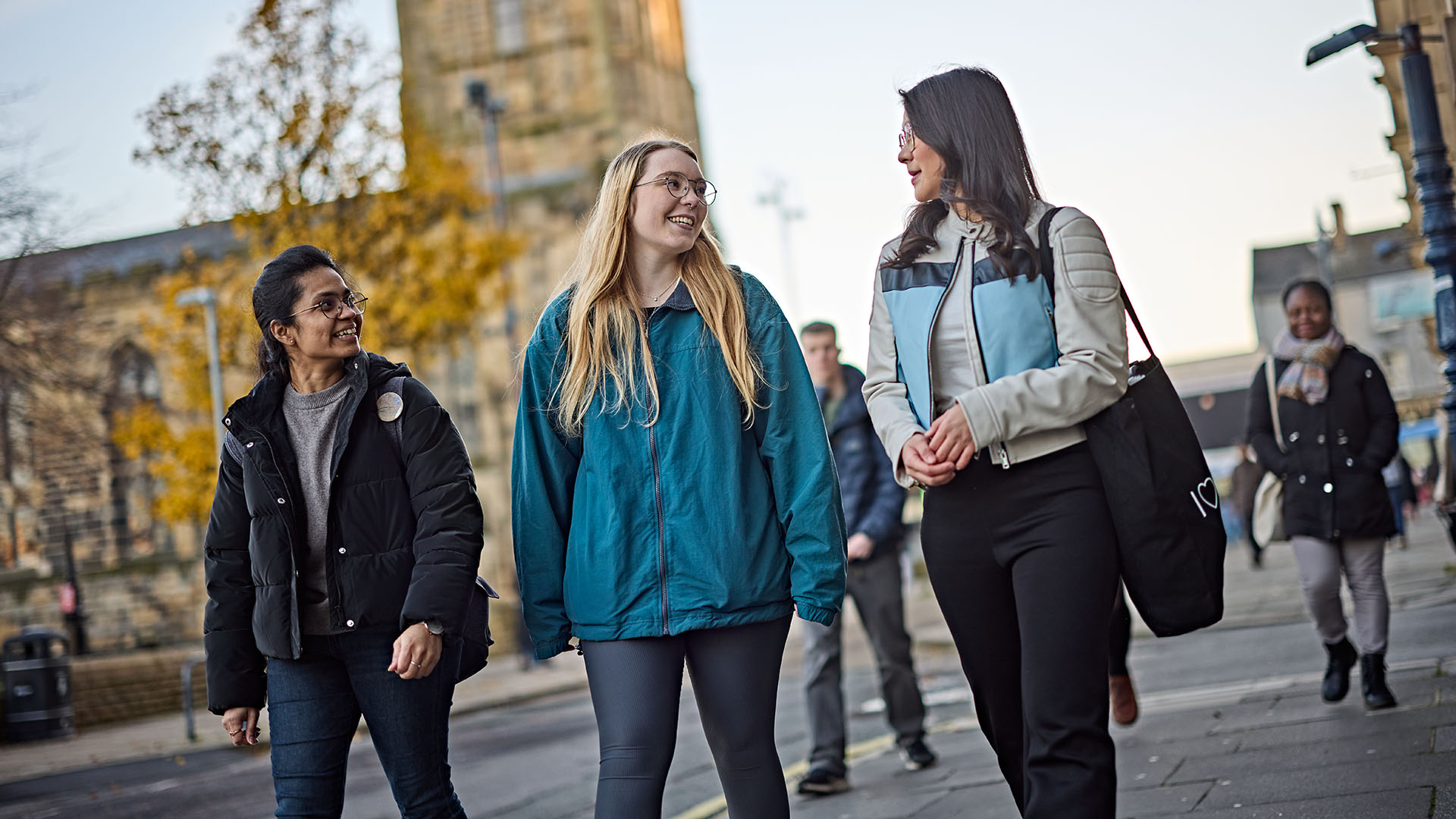 A group of students walking on campus.