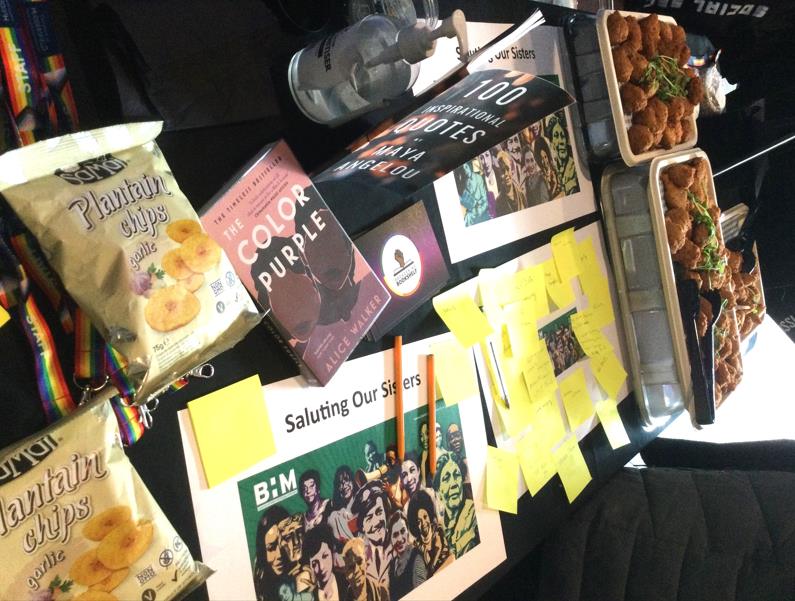 Image of a table with food, posters, snacks