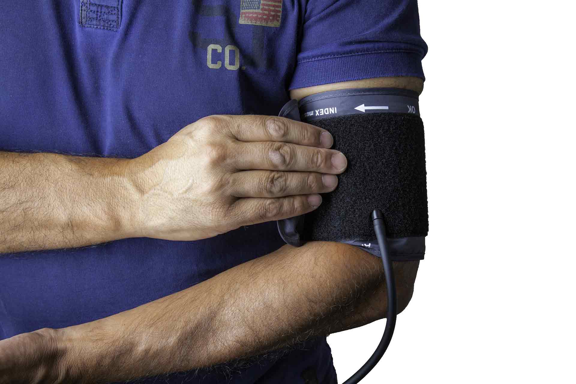 Photo of a man having his blood pressure measured