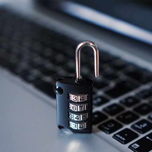 Photo of a padlock on a computer keyboard