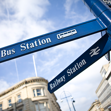Transport sign showing bus and railway station